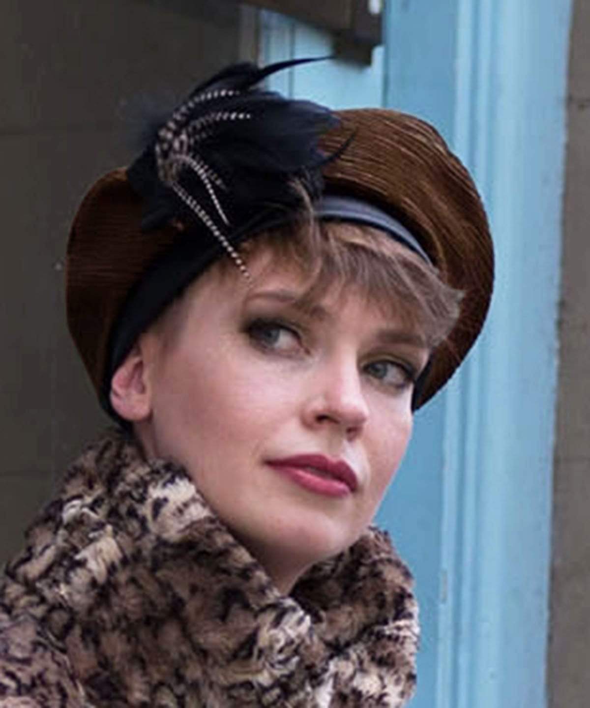 Close up of Model wearing Beret Cohen in Olive with Black Feather Flower Style Brooch | Handsewn in Seattle WA USA | Pandemonium Millinery