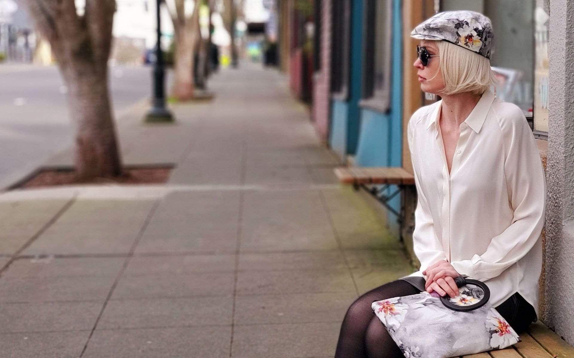 Woman wearing Pandemonium Millinery Charlie Driving Cap | Linen in Multi-Floral | Handmade in Seattle WA