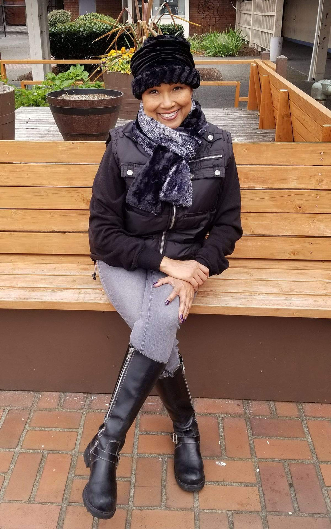 Women sitting outside on bench wearing 1920’s cloche style hat and skinny  Classic Scarf | Black Mamba animal snake print with Cuddly Black Faux Fur | Handmade by Pandemonium Millinery Seattle, WA USA