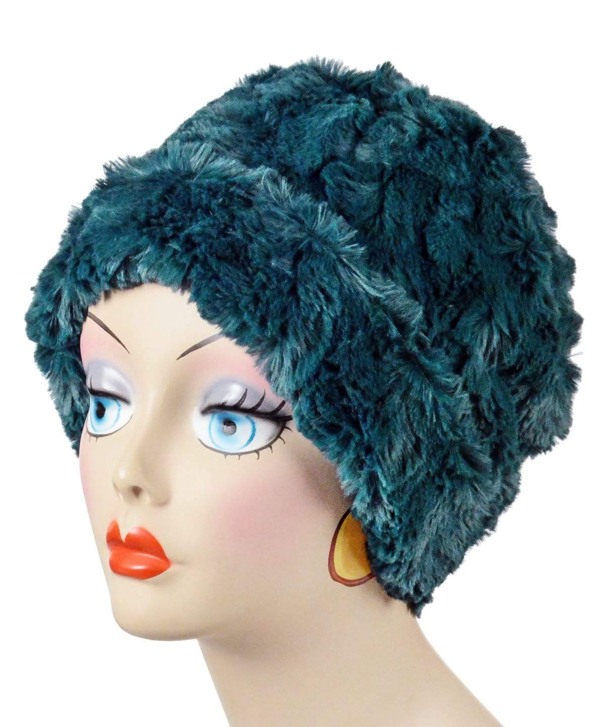 Left side view of Cuffed Pillbox Reversible shown in Peacock Pond Faux Fur by Pandemonium Millinery. Handmade in Seattle, WA USA.