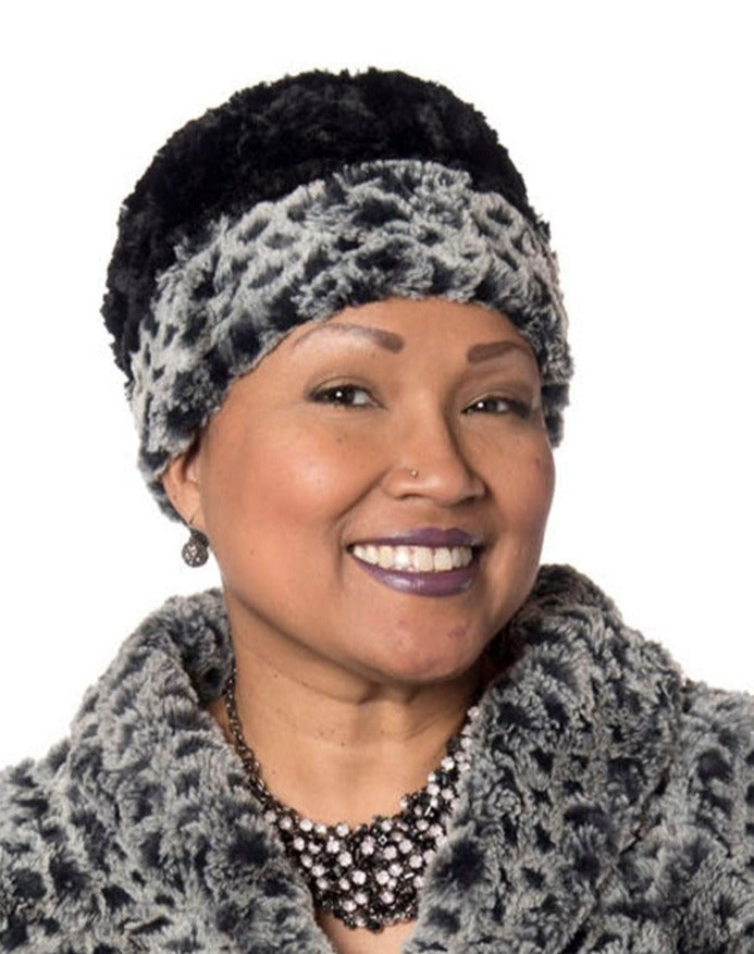 model wearing a Cuffed Pillbox hat style in Luxury Faux Fur  Snow Owl by Pandemonium Millinery made in Seattle Wa