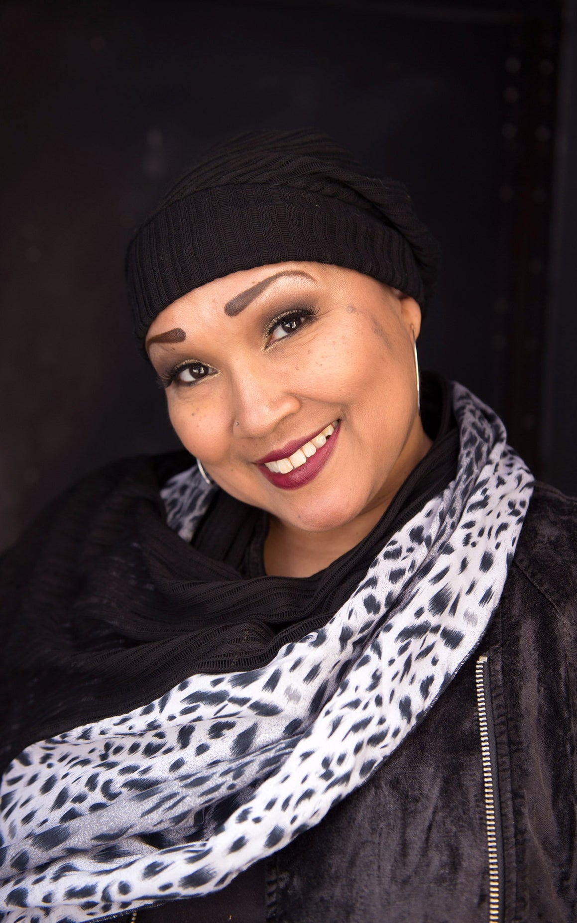 Close up of model wearing Rowdie slouchy style hat and matching  Ladies Two-Tone Handkerchief Scarf, Large Wrap | Shown in White Burmese animal print on Cotton with Voile in Black, Knit | Handmade in Seattle WA | Pandemonium Millinery