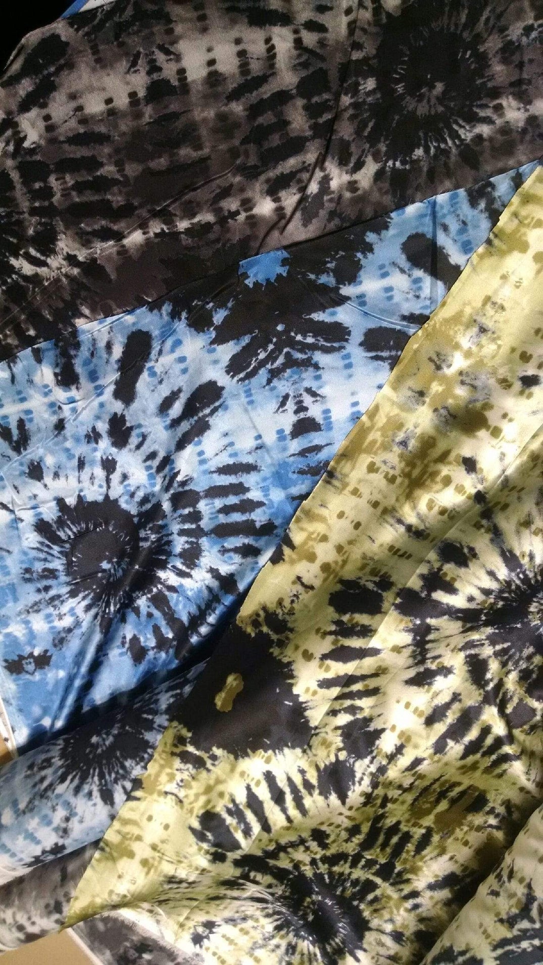 3 color ways of the Egyptian Oasis fabrics layd out on table