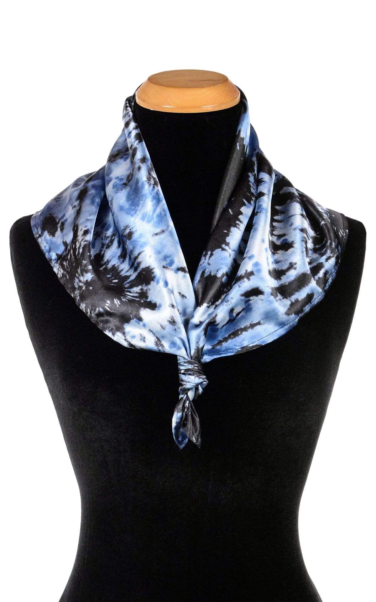 Product shot on a mannequin of Foulard Euro Scarf 21&quot; square tied in front | Egyptian Mirage, black, Blues, and ivory tie-dye | Handmade in Seattle WA | Pandemonium Millinery