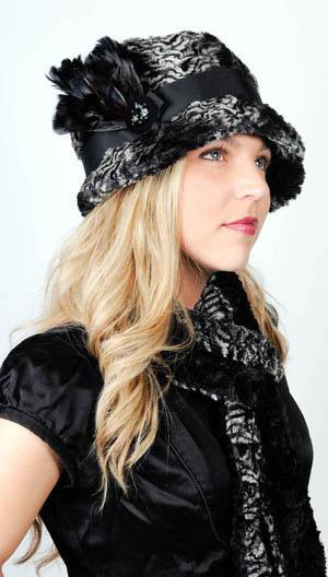 Black Feather Brooch modeled on hat trim. Pandemonium Millinery in Seattle, WA.