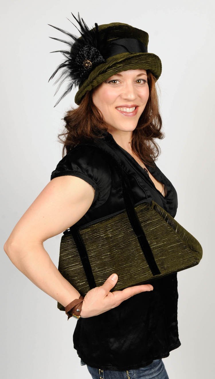 Black Feather Brooch with Interconnected Bow on Green Molly Hat from Pandemonium Millinery