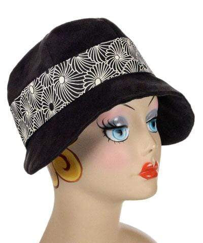  Grace 1920's Cloche Hat in Faux Suede in Black fabric. This hat is also decorated with a Jacquard Band Featuring a Black Flowers outlined in White. Handmade in Seattle, WA, USA by Pandemonium Seattle.