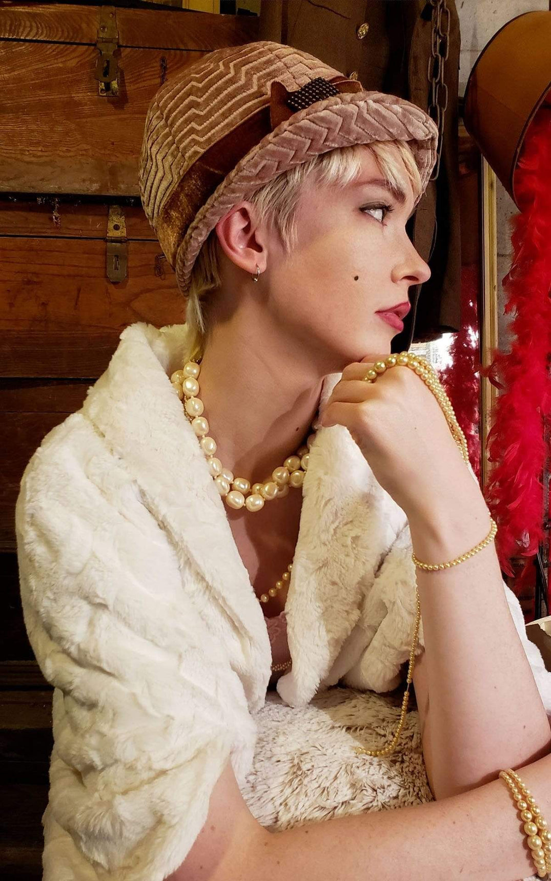 Sideview of Model wearing a Grace Style Cloche Hat  in Chenille in Cherry Blossom with Rouge Pink Velvet Band and Bow with a Copper Square Button Trim | By Pandemonium Millinery | Seattle WA USA