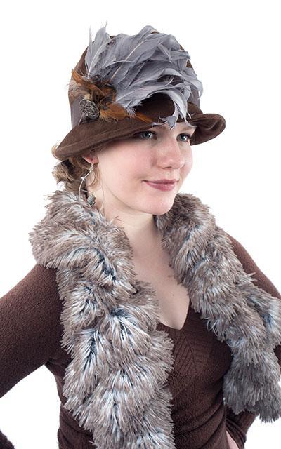  Half Body Shot of Model wearing Grace Cloche Hat in Faux Suede Chocolate with a Chocolate Grosgrain Band, a Silver and Rooster Feather Brooch featuring a Silver Button| Pandemonium Millinery | Seattle WA USA