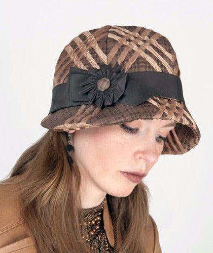 Model wearing Grace 1920s Cloche Style Hat in Copper Plaid with Chocolate  Grosgrain Band  and  Pinwheel trim with matching Button | Handmade in Seattle WA | Pandemonium Millinery