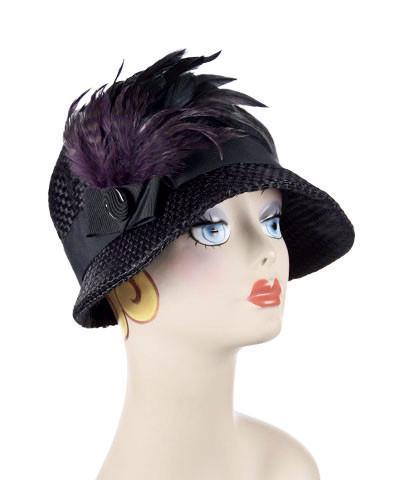 Product Shot of Grace Cloche Interconnected in Black with Black Grosgrain Band featuring Black and Purple Feather Brooch with Glass Button Adornment | Handmade By Pandemonium Millinery | Seattle WA USA