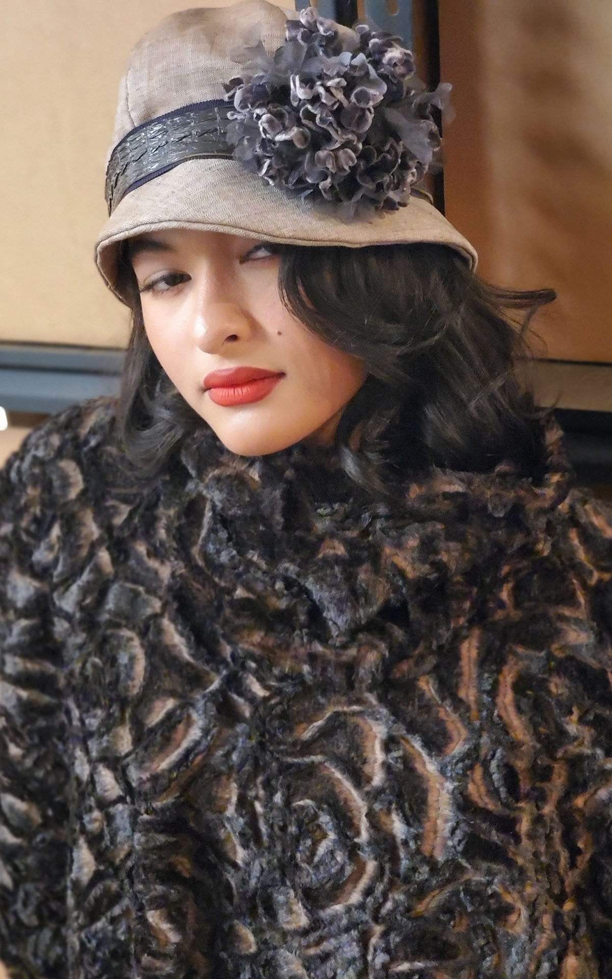 Women wearing Grace Cloche Linen in Coral with Brown Faux Croc Band and Custom Purple Multi Flower Brooch | Handmade By Pandemonium Seattle | Seattle WA USA