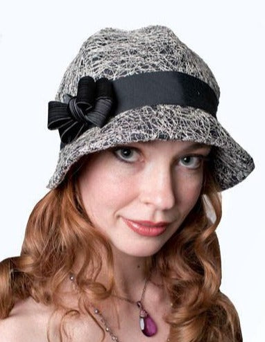 Front view of Model wearing  Grace Cloche in Luna in  Black with Black Grosgrain featuring a Black Bow | Handmade in Seattle WA By Pandemonium Millinery