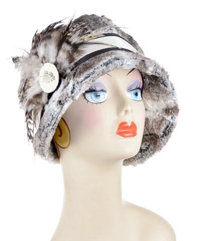 Front view of Model wearing  Grace Cloche in Luxury Faux Fur in Birch with Chocolate Grosgrain Band featuring a Feather Brooch| Handmade in Seattle WA By Pandemonium Millinery