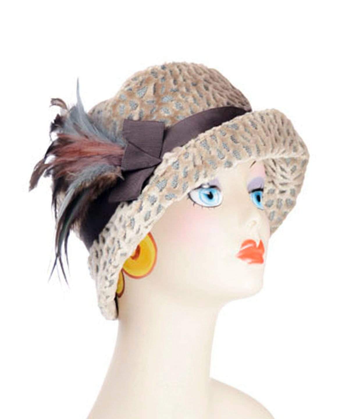 Grace Cloche Hat in Rossini Upholstery Fabric with Chocolate Grosgrain featuring a Mauve and  Blue Steel feather Brooch | By Pandemonium Millinery | Handmade in Seattle WA USA