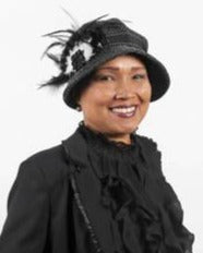 Model wearing Grace Cloche Hat in Statis upholstery Fabric with Black and White Feather featuring a Black Rosette | By Pandemonium Millinery | Seattle WA USA 