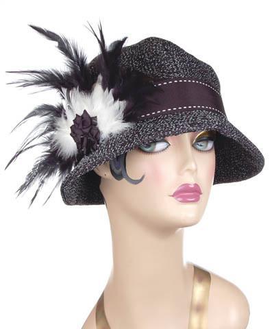 A Product Shot Grace Cloche Hat in Statis upholstery Fabric with Black and White Feather featuring a Black Rosette | By Pandemonium Millinery | Seattle WA USA 