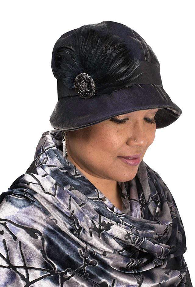 Model wearing Grace Cloche Style Hat Velvet in Smoky Quartz with Black Feather  Brooch featuring Black and Silver | By Pandemonium Millinery | Seattle WA USA