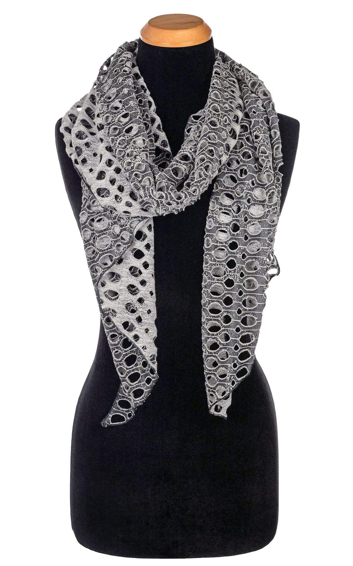 Women’s  Large Handkerchief Scarf, Wrap on Mannequin | Lunar Landing, a black and neutral knit with curled edges surrounding holes| Handmade in Seattle WA | Pandemonium Millinery
