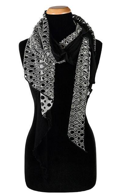 Ladies Two-Tone Handkerchief Scarf on Mannequin | Lunar Landing, a black and neutral knit with curled edges surrounding holes, paired with a light-weight black Jersey Knit | Handmade in Seattle WA | Pandemonium Millinery