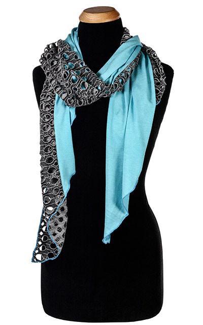 Ladies Two-Tone Handkerchief Scarf on Mannequin | Lunar Landing, a black and neutral knit with curled edges surrounding holes, paired with a light-weight light Blue Jersey Knit | Handmade in Seattle WA | Pandemonium Millinery