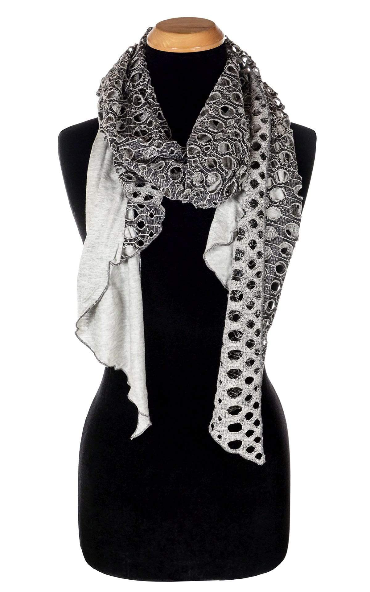 Ladies Two-Tone Handkerchief Scarf on Mannequin | Lunar Landing, a black and neutral knit with curled edges surrounding holes, paired with a light-weight Silver Gray Jersey Knit | Handmade in Seattle WA | Pandemonium Millinery