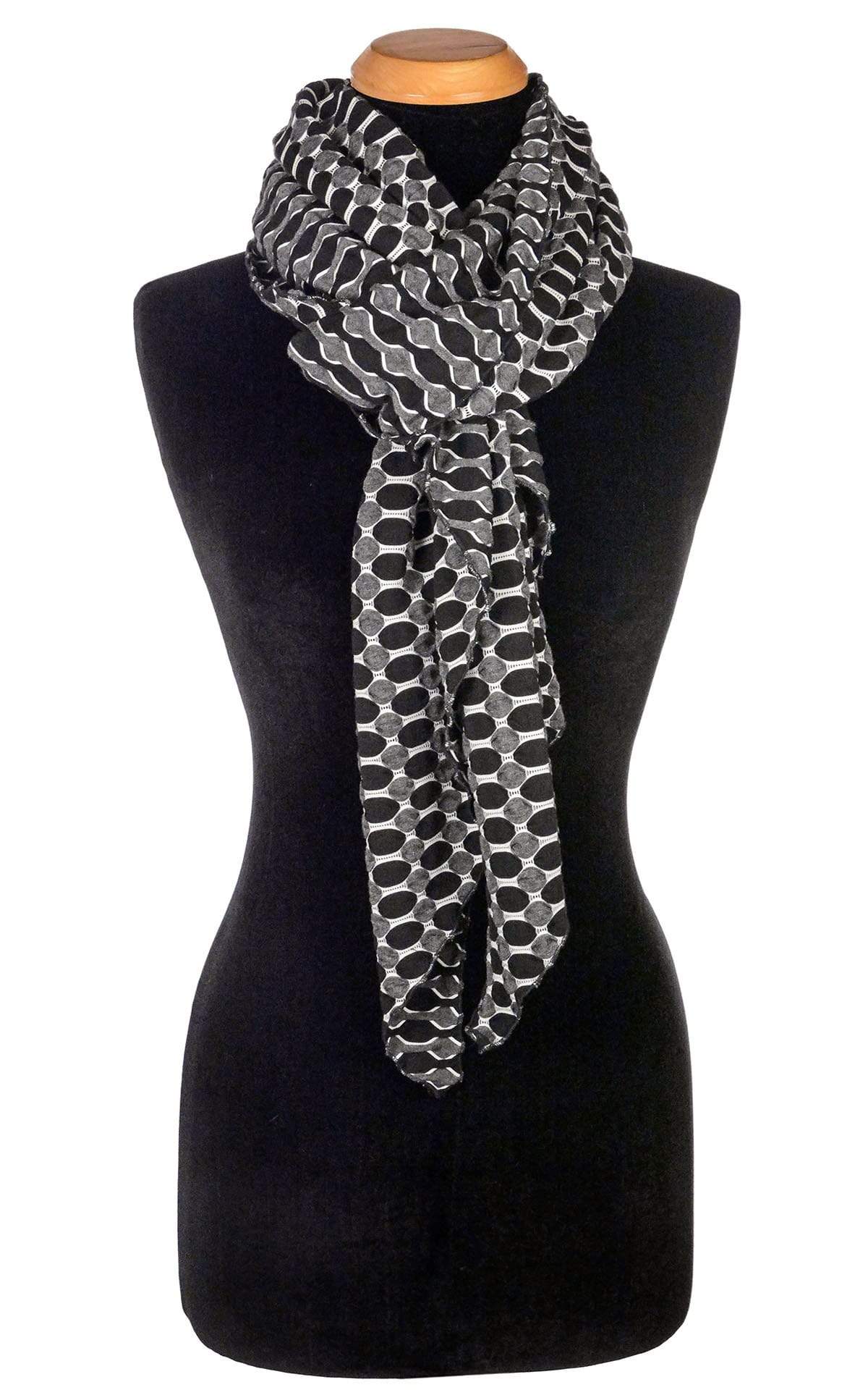 Women’s  Large Handkerchief Scarf, Wrap on Mannequin shown tied | Lunar and Solar Eclipse, black knit with white lattice patterning exposing sections of gray and white| Handmade in Seattle WA | Pandemonium Millinery