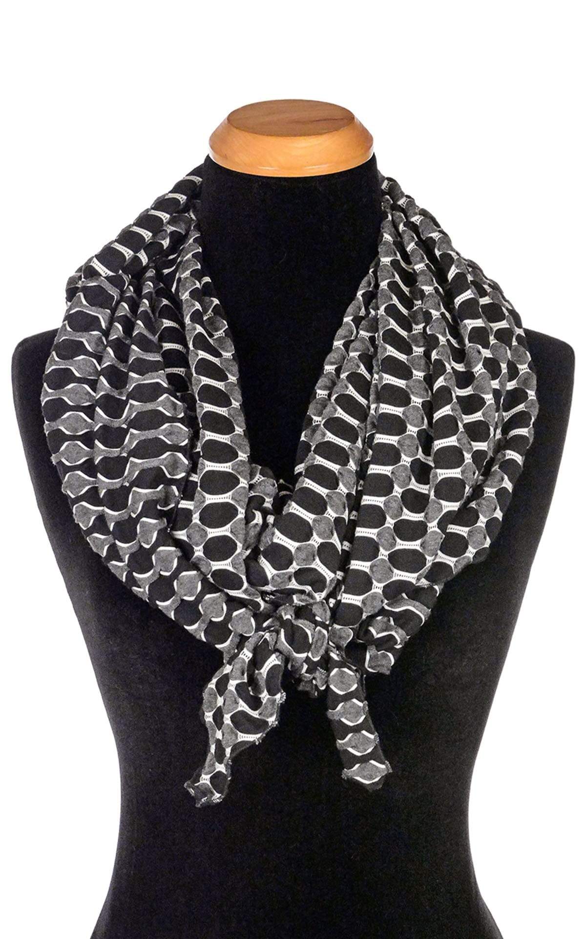 Women’s  Large Handkerchief Scarf, Wrap on Mannequin shown tied in fornt | Lunar and Solar Eclipse, black knit with white lattice patterning exposing sections of gray and white| Handmade in Seattle WA | Pandemonium Millinery