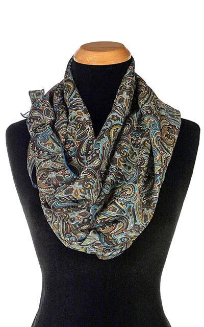 Women’s Large Handkerchief Scarf, Wrap on Mannequin wrapped around twice | Peacock Paisley Chiffon in blue, greens, and browns | Handmade in Seattle WA | Pandemonium Millinery