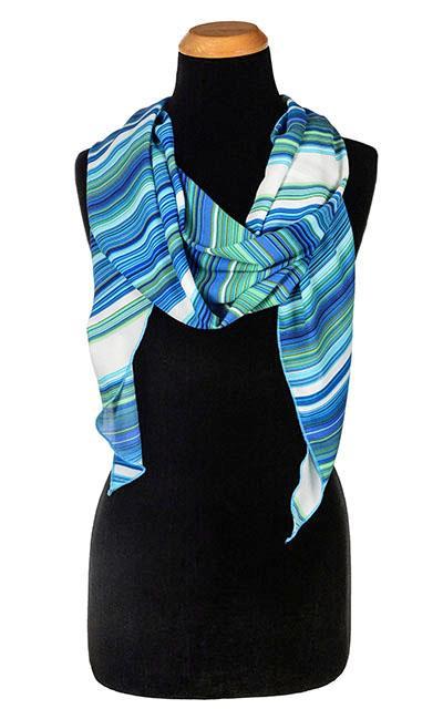 Women’s Large Handkerchief Scarf, Wrap on Mannequin | Shown in Sea Breeze a striped pattern on blues, turquoise, greens, and ivory | Handmade in Seattle WA | Pandemonium Millinery