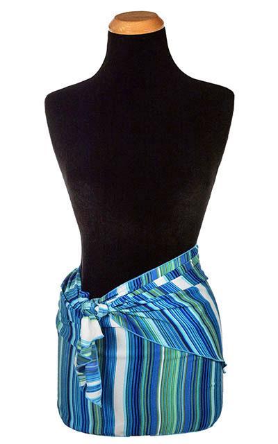 Women’s Large Handkerchief Scarf, Wrap on Mannequin shown tied up as skirt | Shown in Sea Breeze a striped pattern on blues, turquoise, greens, and ivory| Handmade in Seattle WA | Pandemonium Millinery