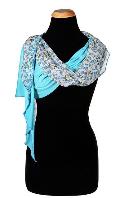 Women’s  Large Handkerchief Scarf, Wrap on Mannequin Ocean of Emptiness Jersey Knit with Victory Garden floral print in blues and ivory| Handmade in Seattle WA | Pandemonium Millinery