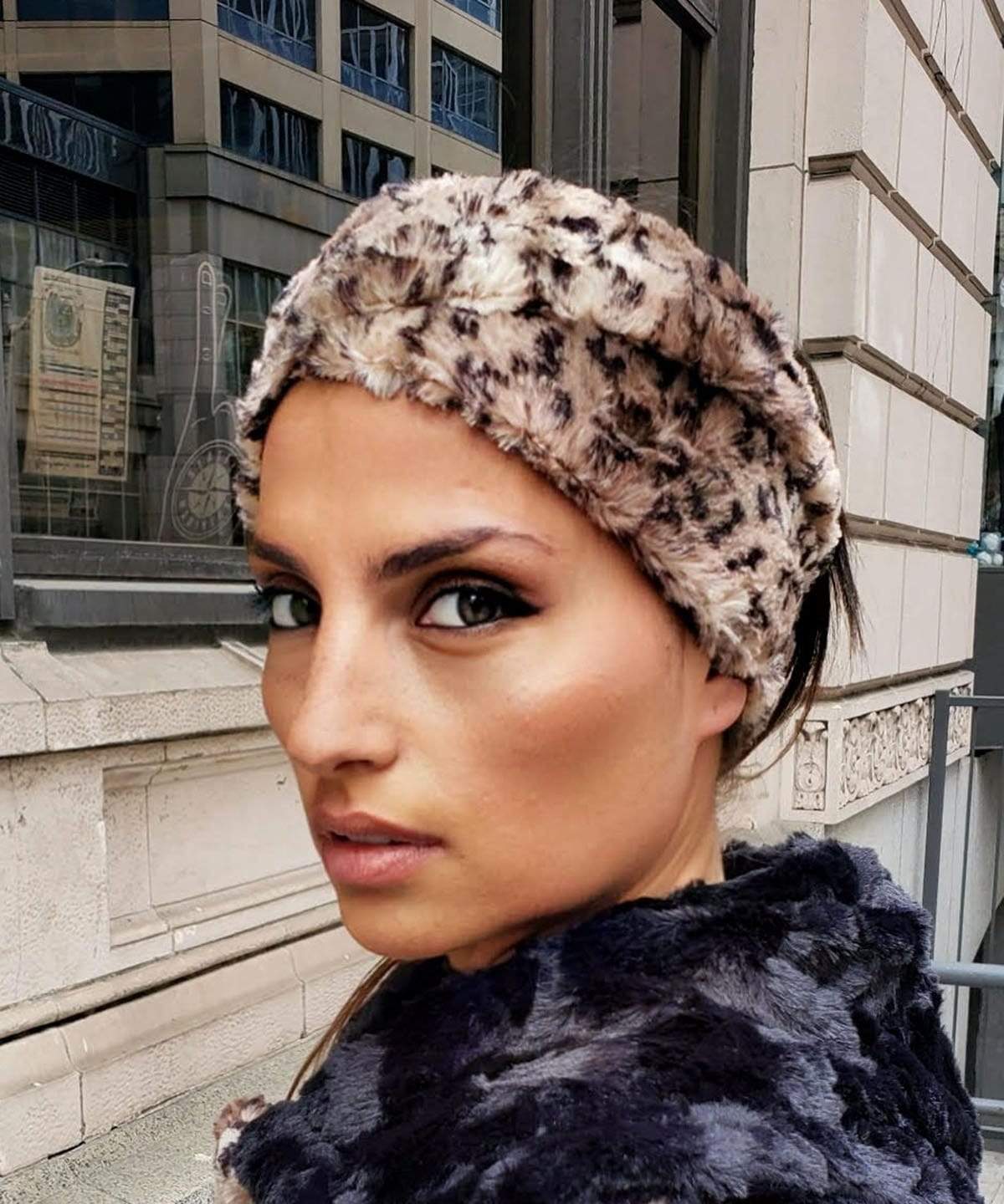 Model in wearing Headband in front of building | Carpathian Lynx, brown and cream Faux Fur | Handmade by Pandemonium Millinery Seattle, WA USA
