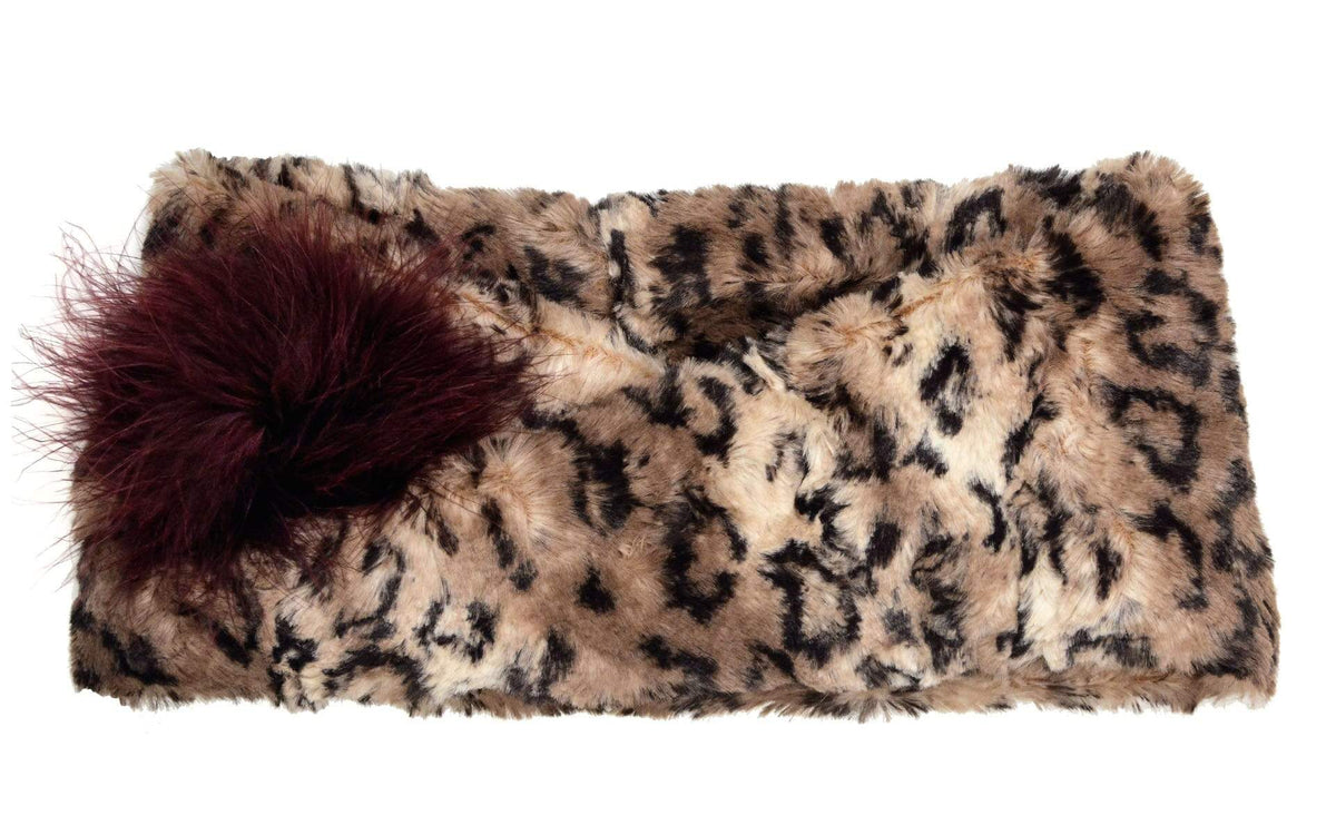 Product shot of Headband, Ear and Neck Warmer with feather trim | Carpathian Lynx, brown and cream Faux Fur | Handmade by Pandemonium Millinery Seattle, WA USA