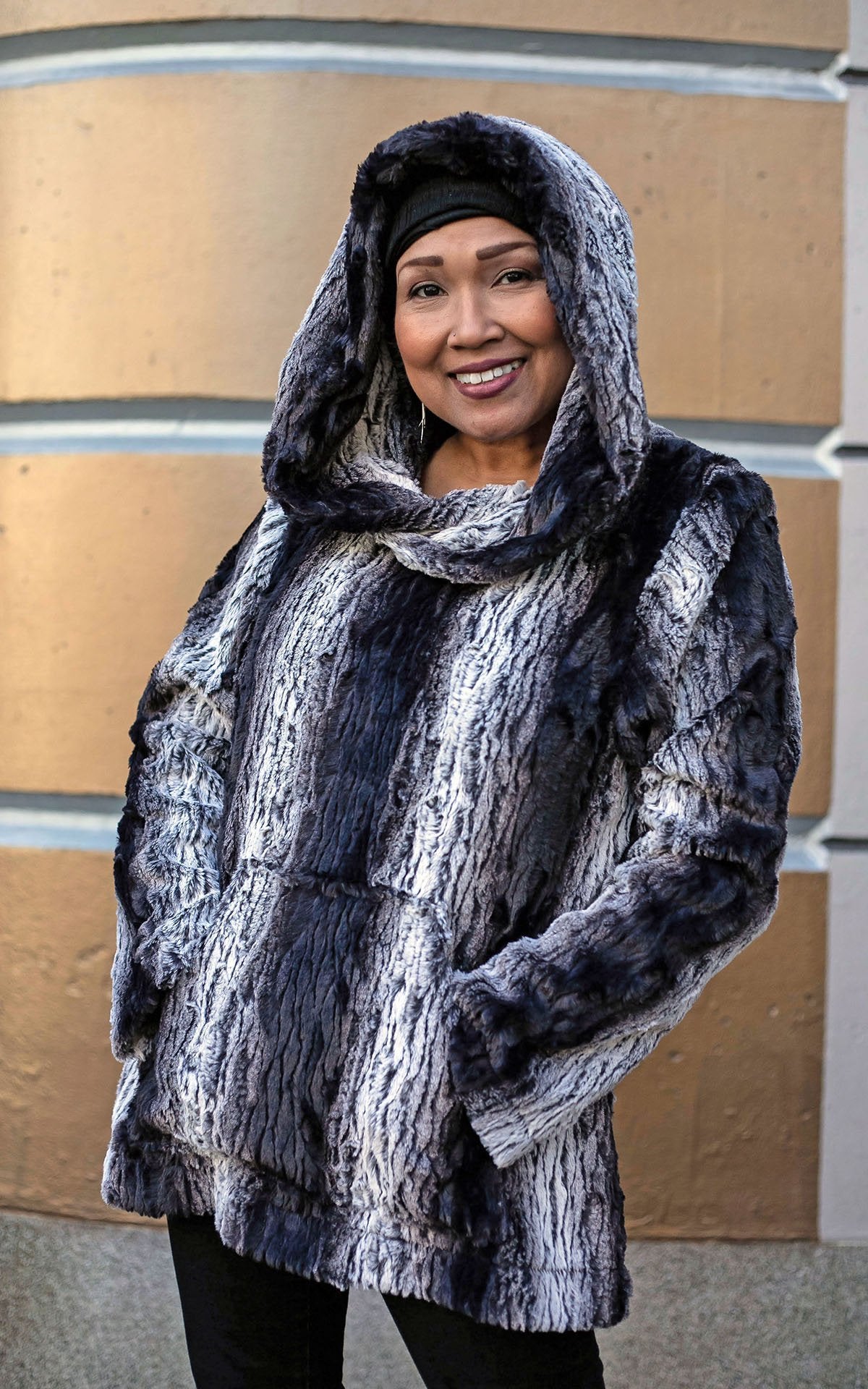 Woman wearing Hoody Lounger with hood up | Luxury Faux Fur in Smouldering Sequoia, Black and White Vertical Stripes | Handmade By Pandemonium Millinery | Seattle WA USA