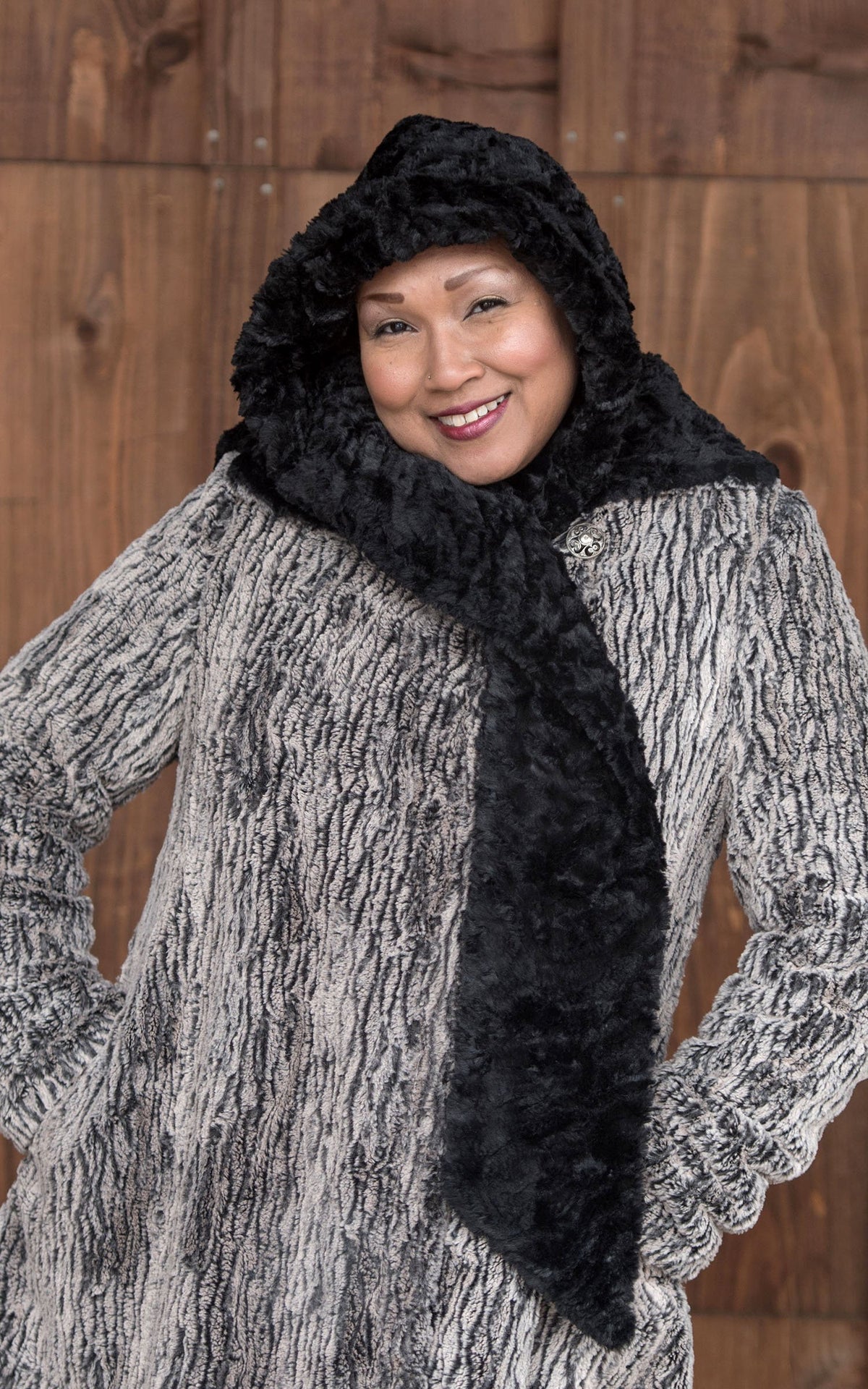 Model is wearing Hoody Scarf in Cuddly Fur in Black