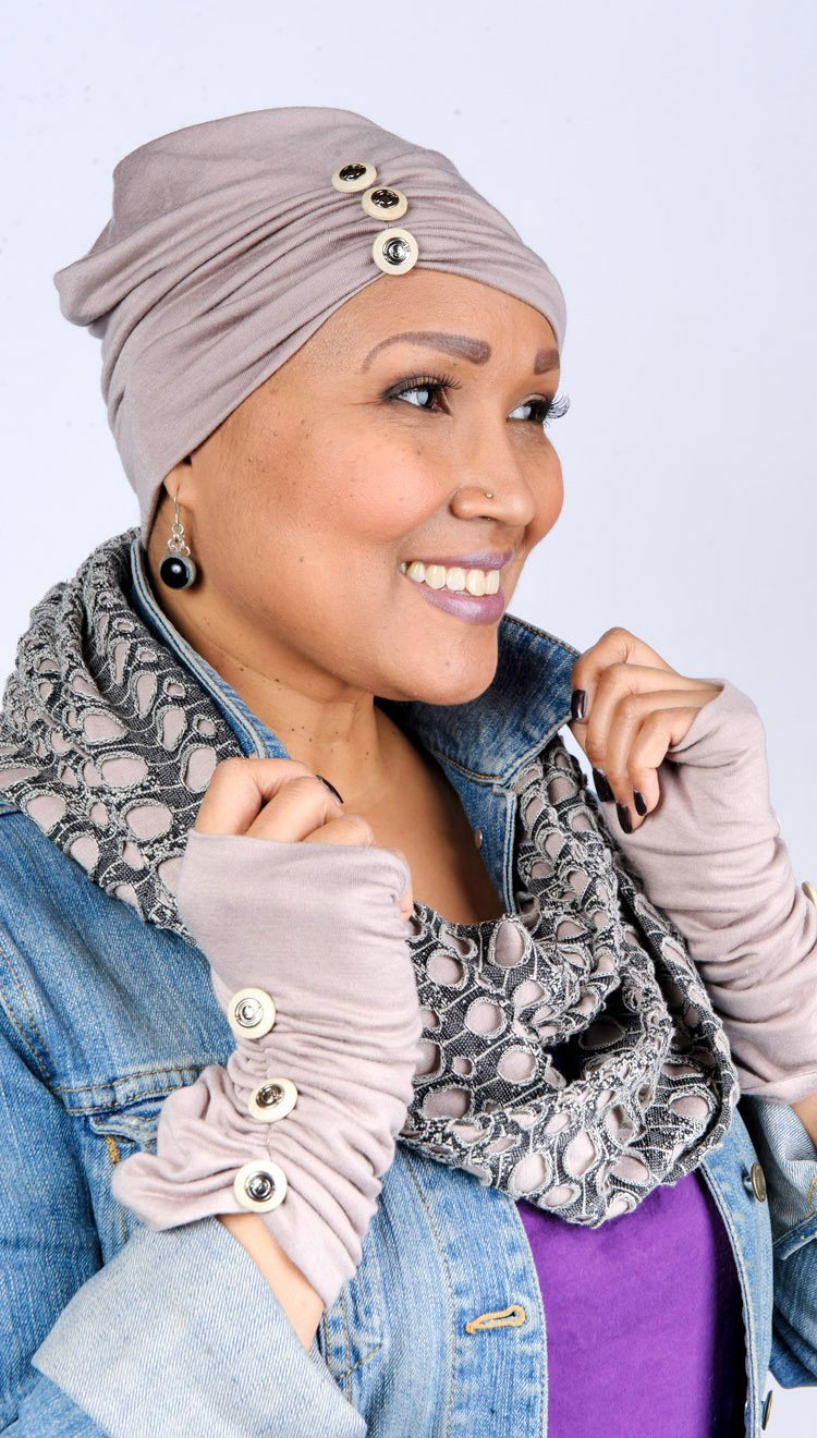 Model wearing scrunched Fingerless Gloves and Edith slouchy hat with matching Infinity loop Scarf | Lunar Landing, a black and neutral knit with curled edges surrounding holes, paired with a light-weight tan Jersey Knit | Handmade in Seattle WA | Pandemonium Millinery