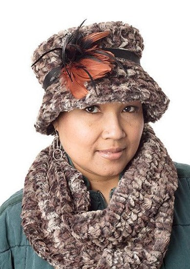 Model wearing Molly hat style with feather trim and matching Women&#39;s Infinity Loop Scarf on Mannequin | Calico Faux Fur in Browns and creams, blacks | Handmade in Seattle WA | Pandemonium Millinery