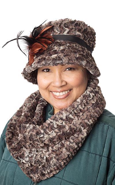 Model wearing Molly hat style with feather trim and matching Women's Infinity Loop Scarf on Mannequin | Calico Faux Fur in Browns and creams, blacks | Handmade in Seattle WA | Pandemonium Millinery