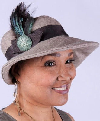 Woman wearing Katherine Wide Brim Hat Natural Linen with Chocolate Grosgrain Band and  Natural Feather Brooch | Handmade in Seattle WA | Pandemonium Millinery