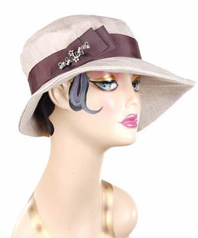 Woman wearing Katherine Wide Brim Hat Natural Linen with Chocolate Grosgrain Band and  Natural Feather Brooch | Handmade in Seattle WA | Pandemonium Millinery
