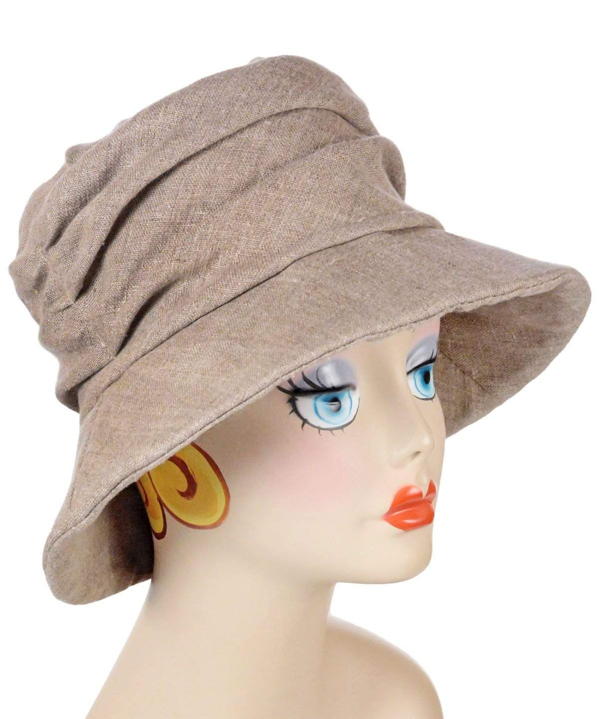 Woman wearing Cuffed Krystyne Bucket Hat in Natural Linen Handmade in Seattle WA by Pandemonium Millinery USA