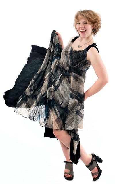 Woman swaying in Lilium Dress in Blue Lovely Lace with Abyss Black Jersey Knit handmade in Seattle WA from Pandemonium Millinery USA