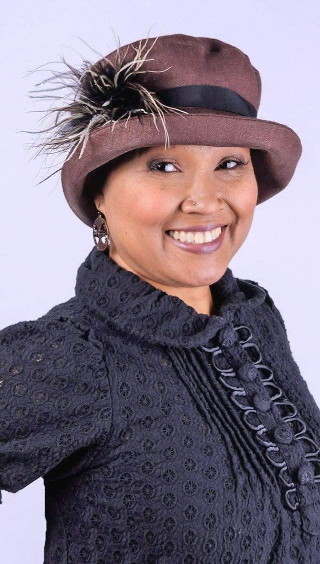 Woman wearing Molly Bucket Style Hat in Chocolate Linen with Black Band with Chocolate, Cream and Black Ostrich Brooch | Handmade By Pandemonium Millinery in Seattle WA