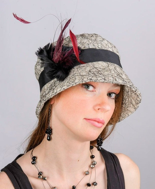 Molly Bucket Style Hat Luna in White with Black Band featuring a Black and Burgundy Feather Brooch | Handmade By Pandemonium Millinery | Seattle WA USA