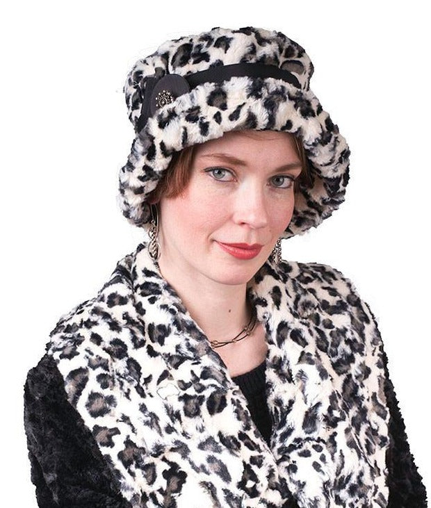 Model in Faux Fur Jacket is wearing Molly Hat Bucket Style Hat | Luxury Faux Fur In White Jaguar | Black Grosgrain Band with Black and White Feather Brooch | Handmade by Pandemonium Seattle