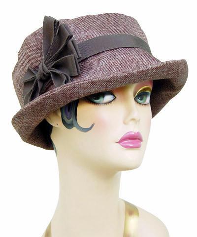 Model wearing Molly Bucket Origin in Java | Black Grosgrain Band with Mauve an Black Feather Brooch | Handmade By Pandemonium Millinery in Seattle WA