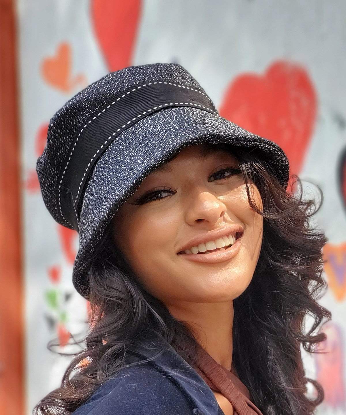 Woman wearing Molly Hat Static Upholstery Fabric with Saddle Stitch Grosgrain  Band | Handmade By Pandemonium in Seattle WA