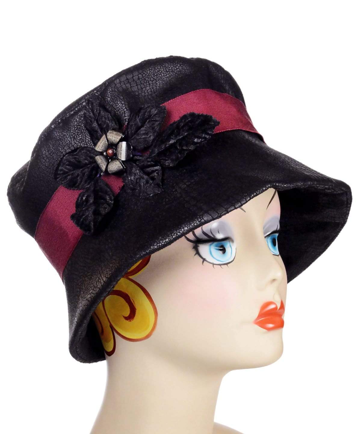 Molly Bucket Style Hat, brim down, Vegan Leather in Outback Black with Velvet leaves and Floral Button Brooch | Pandemonium Millinery | Seattle WA
