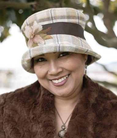 Model wearing Molly Hat Wool Plaid in Day Break with Chocolate Grosgrain Band and  Flower Applique | Handmade by  Pandemonium Millinery | Seattle WA USA